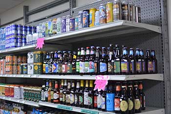 A selection of beers on shelves at Hickey's Wine & Spirits.