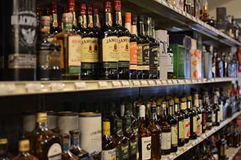 A selection of spirits on shelves at Hickey's Wine & Spirits.