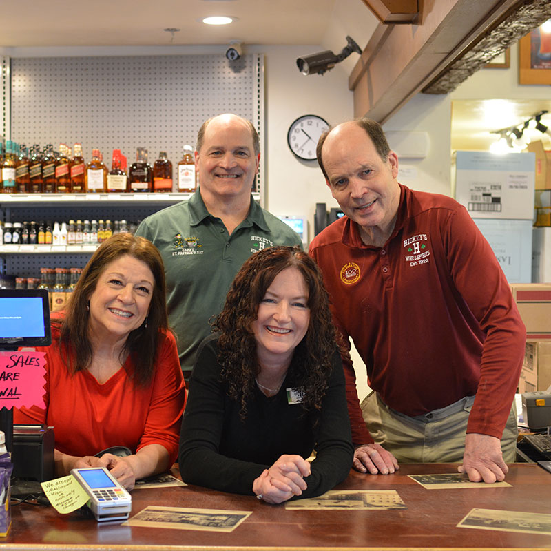 Hickey's Wine & Spirits staff group photo, including family owners Charlie and Kevin Hickey.