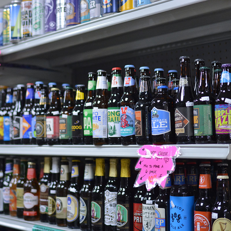 A selection of beers on shelves at Hickey's Wine & Spirits.