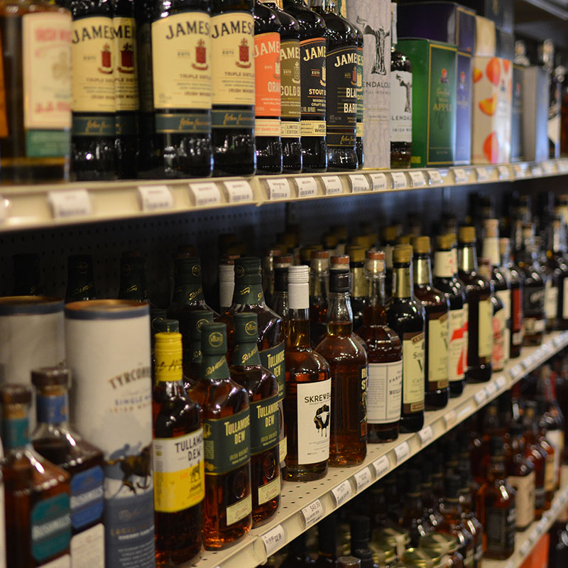 A selection of spirits on shelves at Hickey's Wine & Spirits.