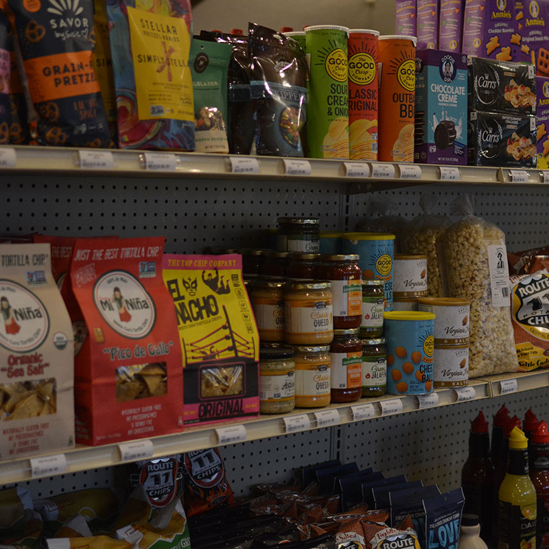 Snacks and party food on shelves that are available at Hickey's Wine & Spirits.