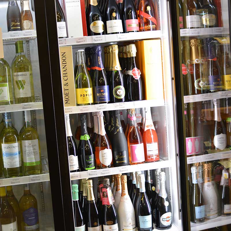 Sparkling wines and whites in coolers at Hickey’s Wine & Spirits.